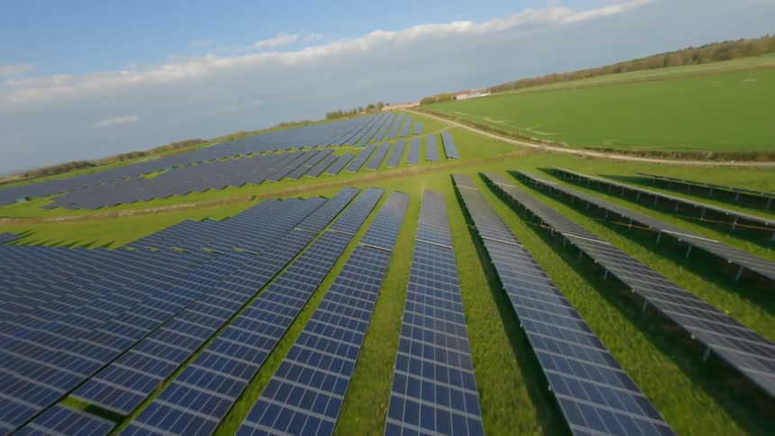 Aerial view of solar panels laid out in a field