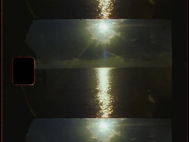 The setting sun reflects on the ocean