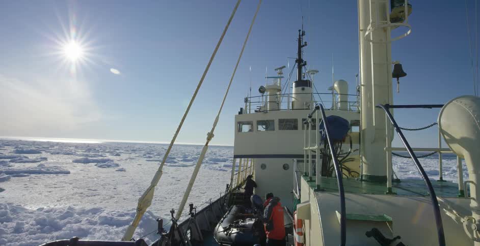 A ship is sailing in ice filled water