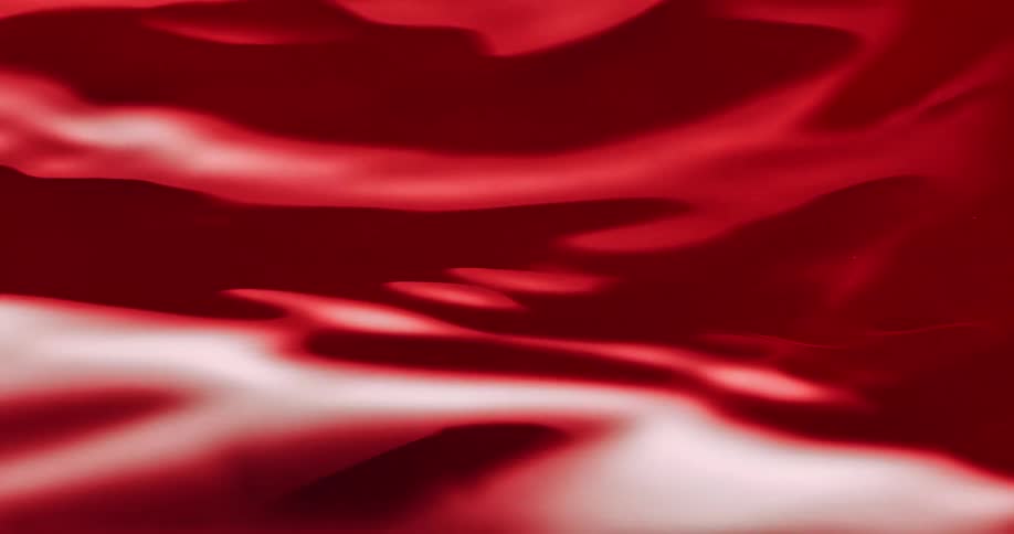 Close up of red paint flowing