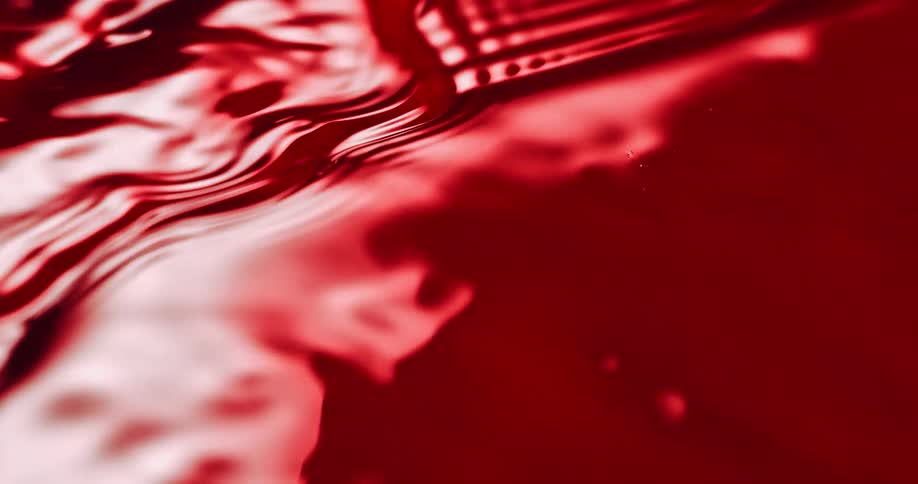 The red liquid moves in waves