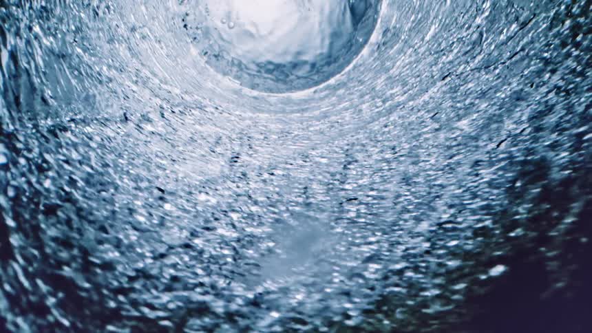 Water swirls around in a circular manner in this abstract scene
