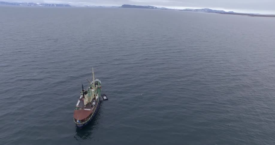 A large boat is sailing in the water below