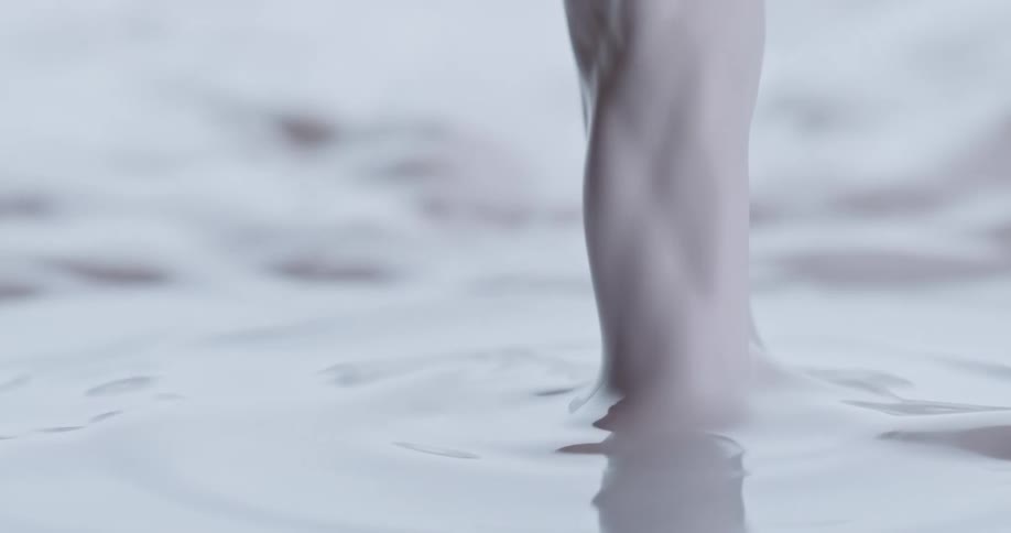 White paint being poured into white paint