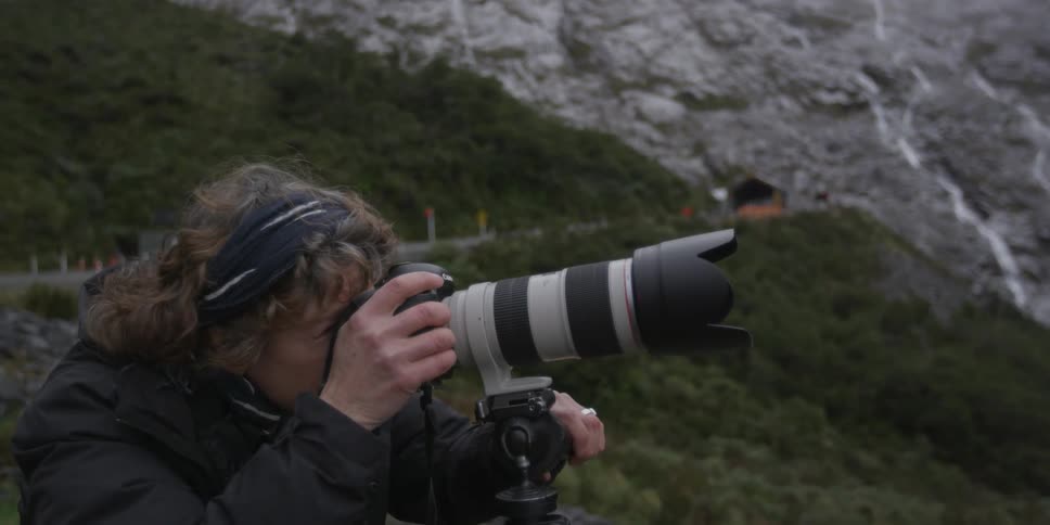 A woman is taking photographs