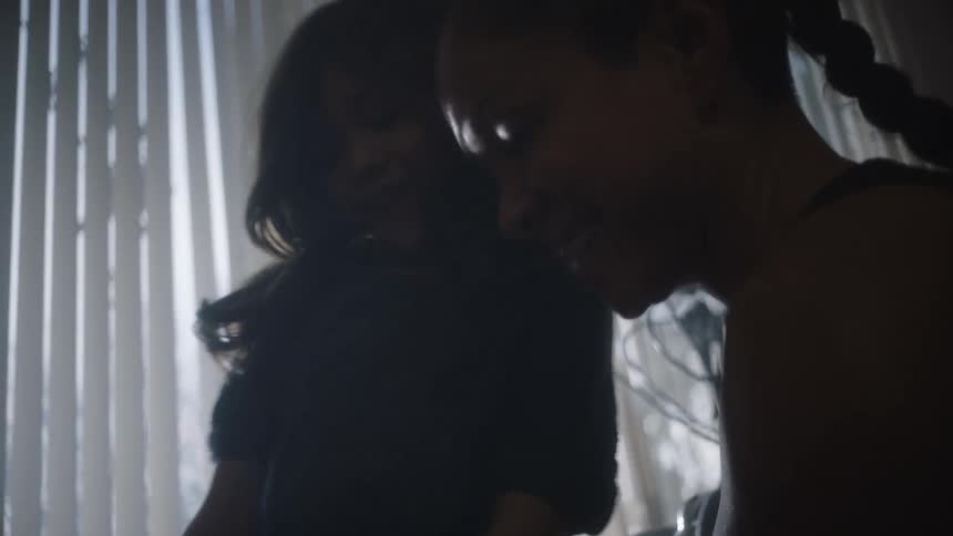 A mother and daughter laugh