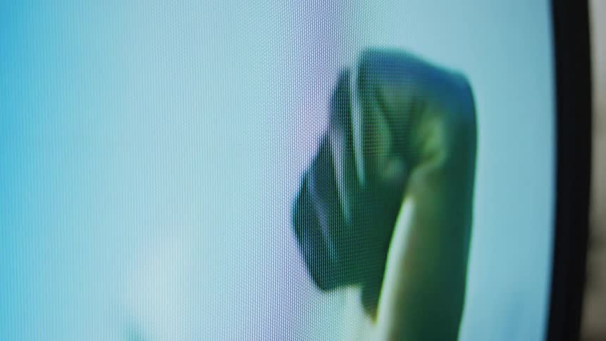 Person on television holds their fist up