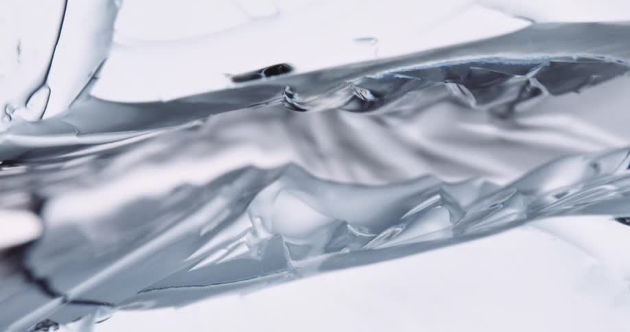 A close up of a block of ice breaking and creating a complete separation
