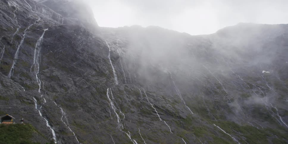 A misty mountain during the day