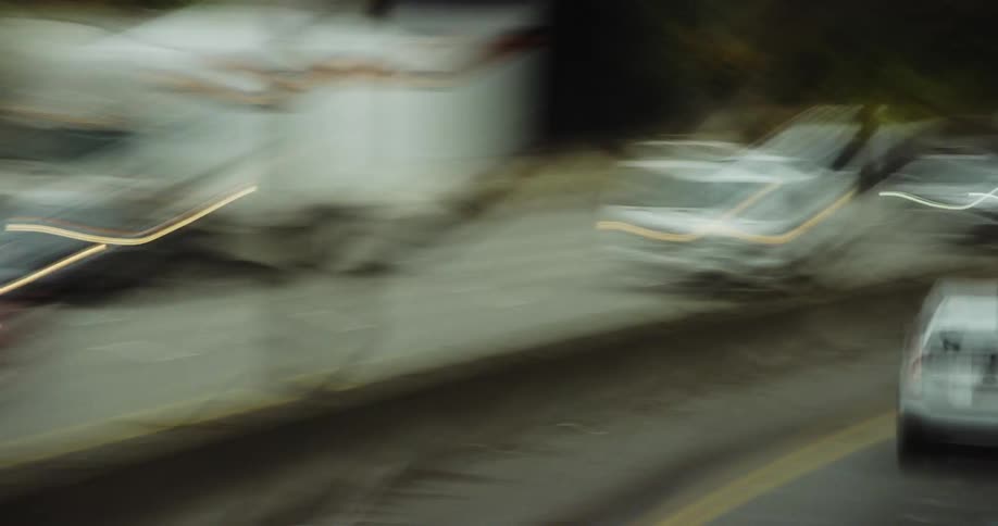 Traffic is heavy in this chaotic and abstract time lapse driving shot communicating confusion or chaos