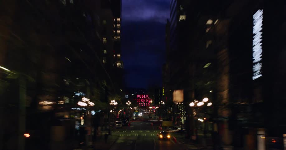 Time lapse view of pedestrians and traffic in a city during the night