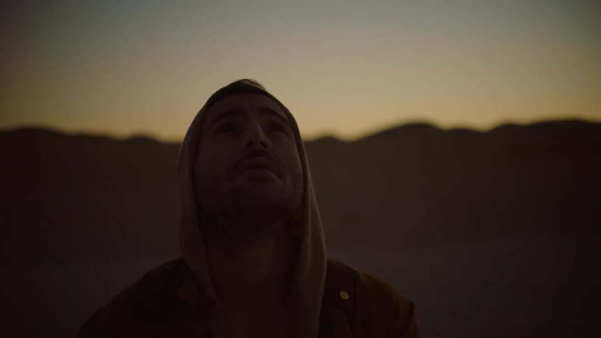 A man is looking up into the sky