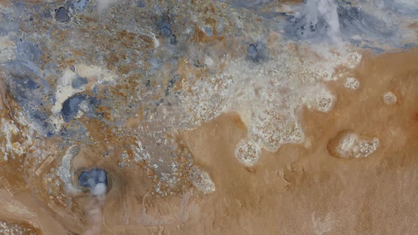 Clouds flow over blue and icy surface