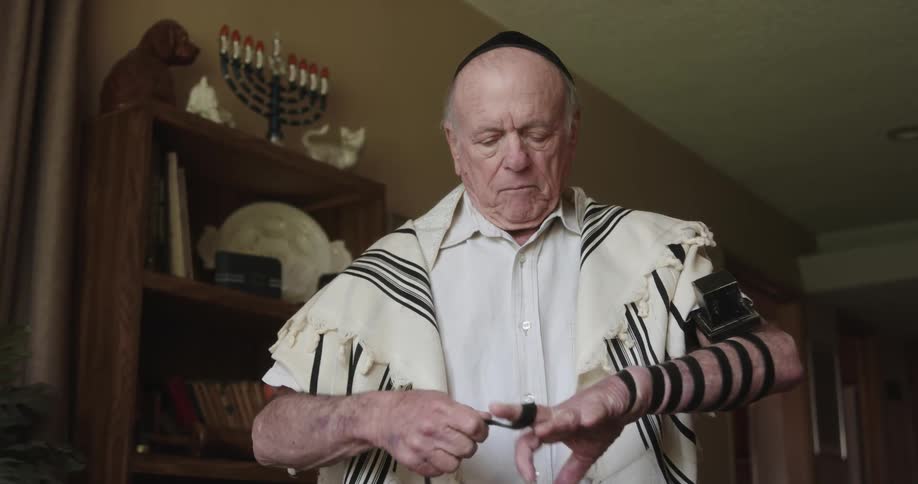 A man is taping up his arm
