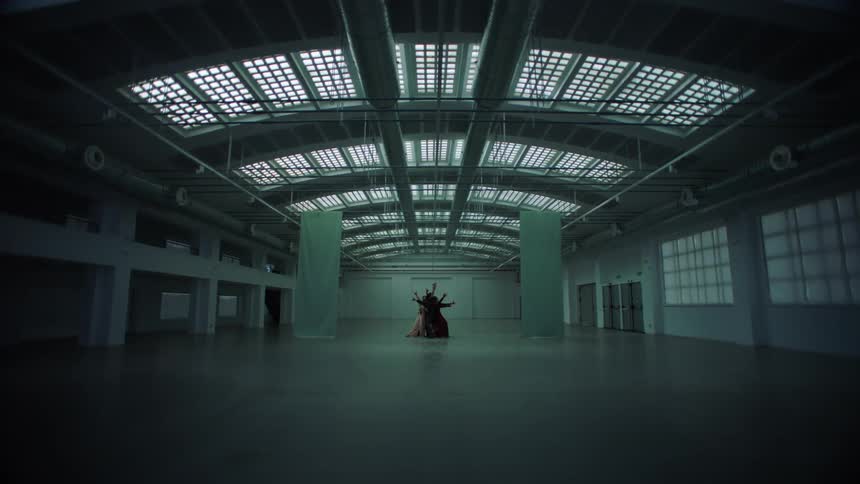 The interior of a large empty warehouse