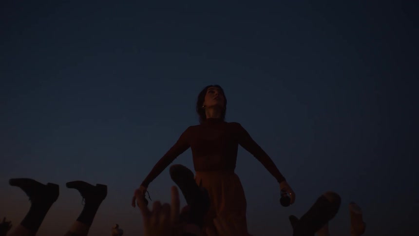 A group of people dancing outdoors