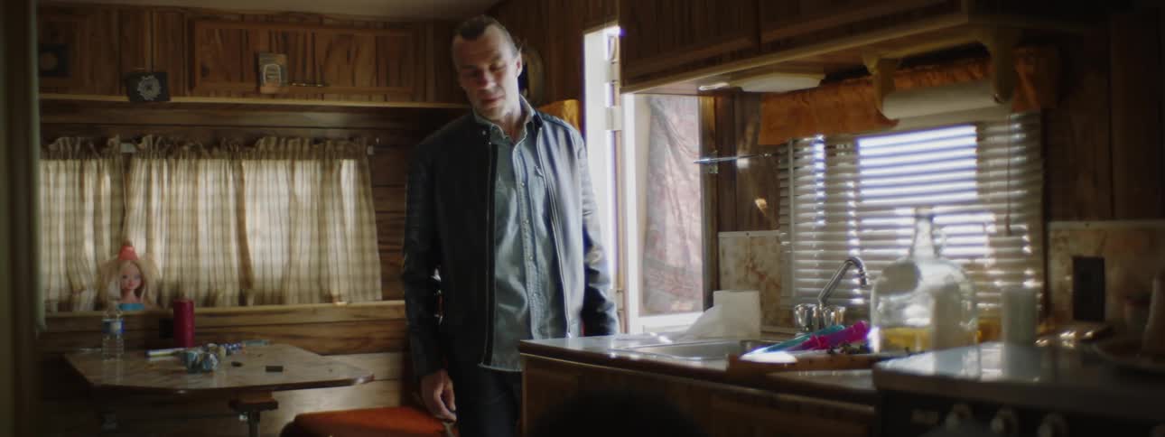 A man is yelling at someone in the kitchen