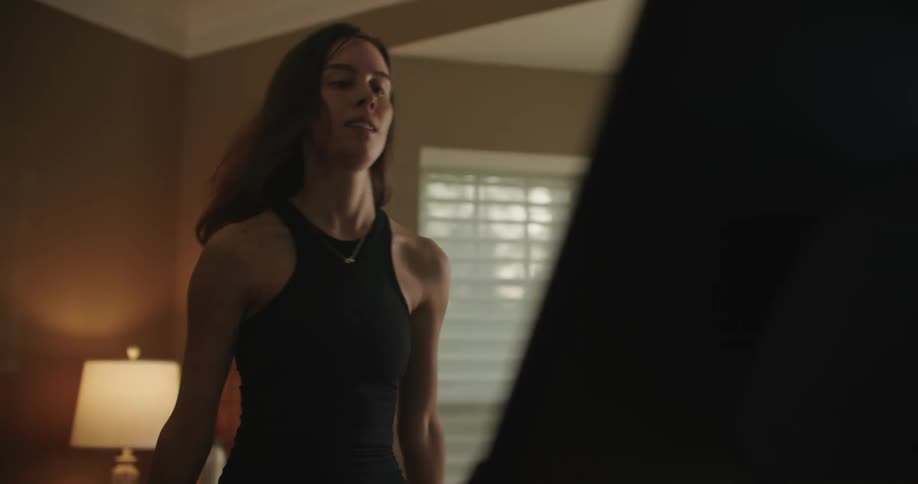 A woman exercising on a stationary bike