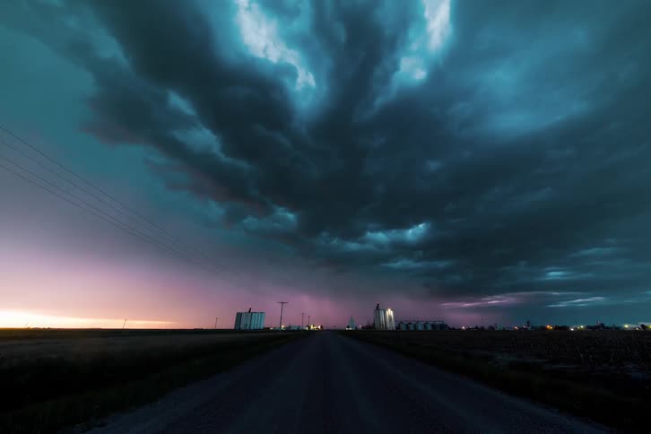 Time lapse of a storm with lightning traveling over a town
