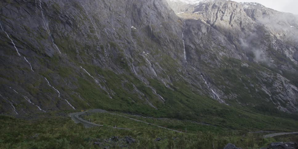A forested valley with a road running through it