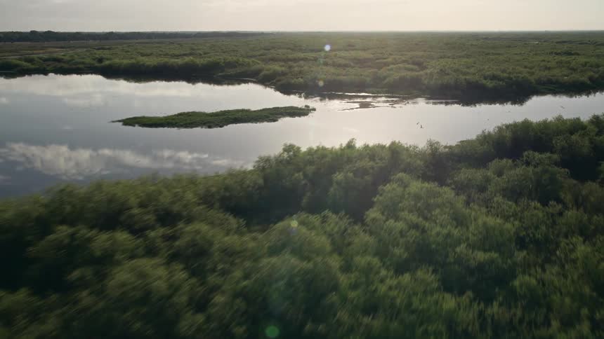 A breathtaking sunrise over the St Johns River near Orlando Florida as captured from a low-flying aerial perspective