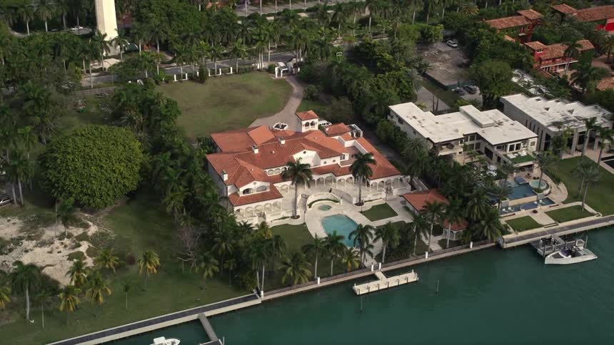 A birds eye view of upscale homes on Star Islands shoreline Miami Florida