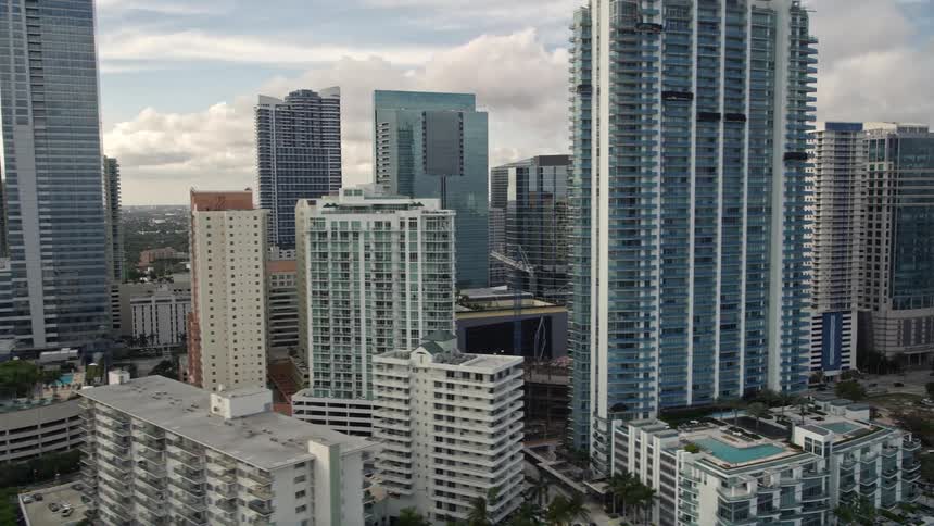 Aerial view of condominium high-rises in Downtown Miami Florida on a partly cloudy day