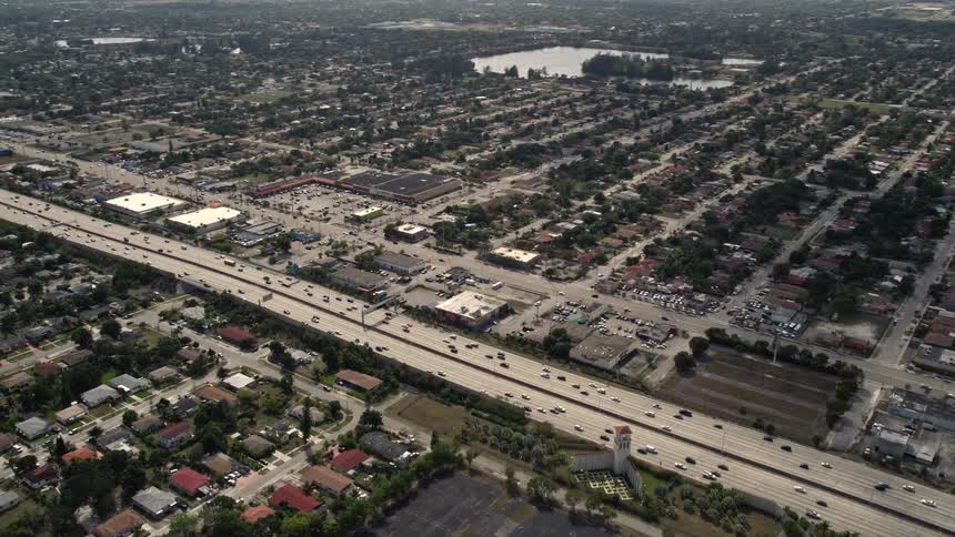 Aerial view of light traffic on Interstate 95 through Miami Shores Florida during daytime