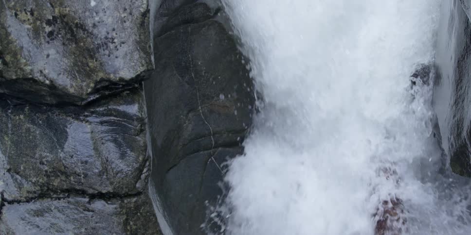 Water rapidly splashing down a rocky formation