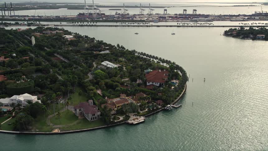 Aerial footage of luxurious waterfront mansions on Star Island Florida