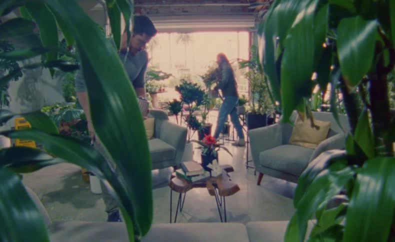 Two people are working in the florist