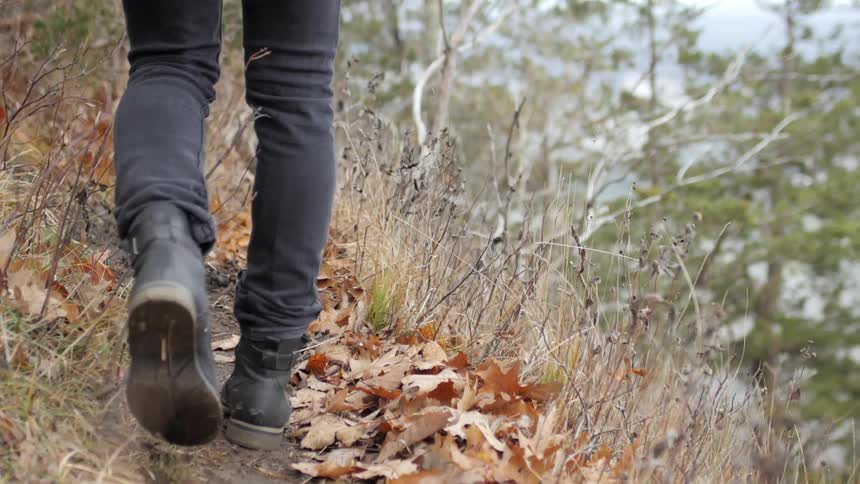 A person walks along a path outside