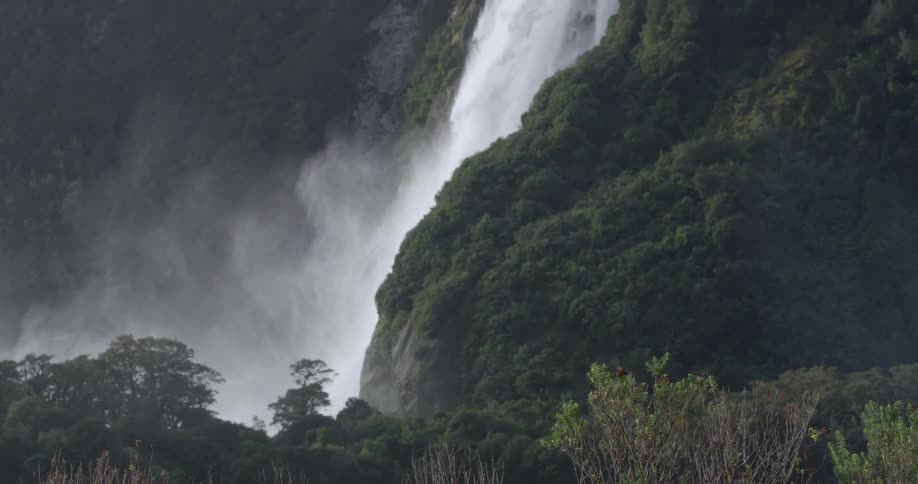 A waterfall gushes down a steep incline