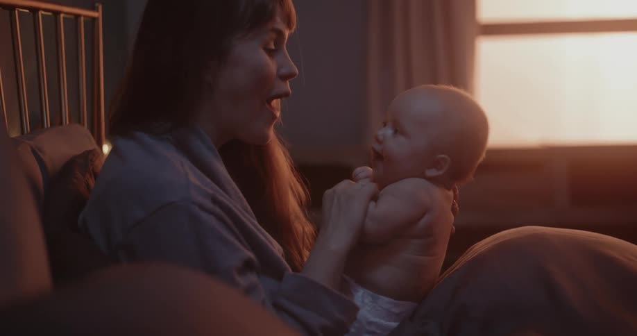 A woman speaks to her baby in a baby voice