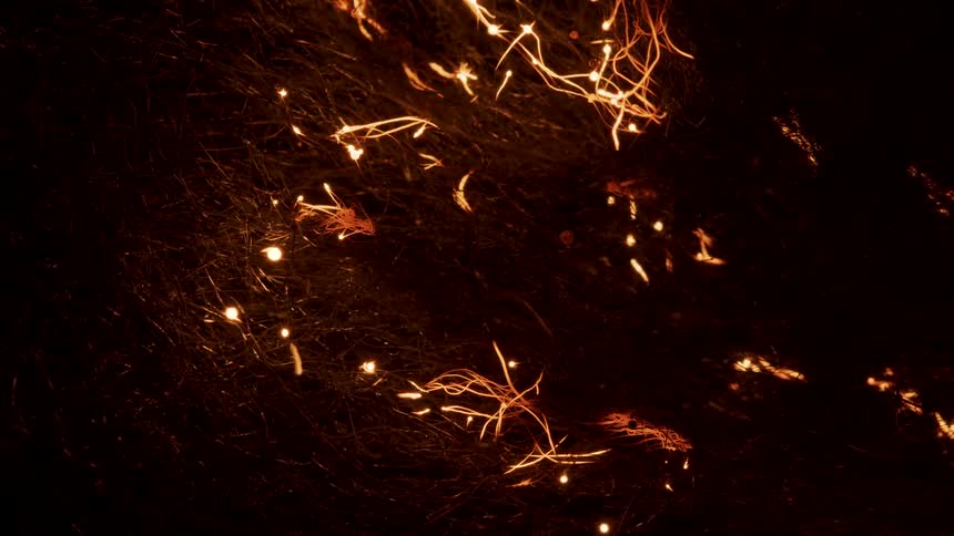 Grass glows orange after being ignited