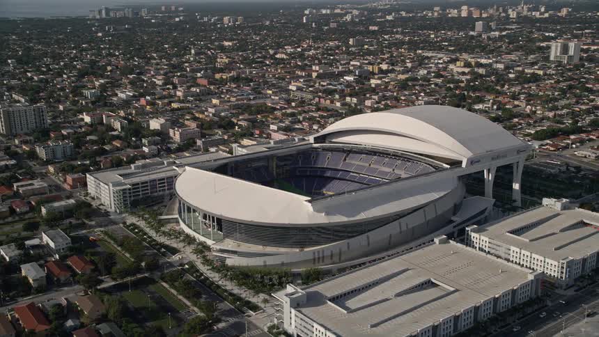 A stunning 5K aerial orbit of Marlins Park stadium in sunny Miami Florida showcasing the grandeur of the empty sports arena