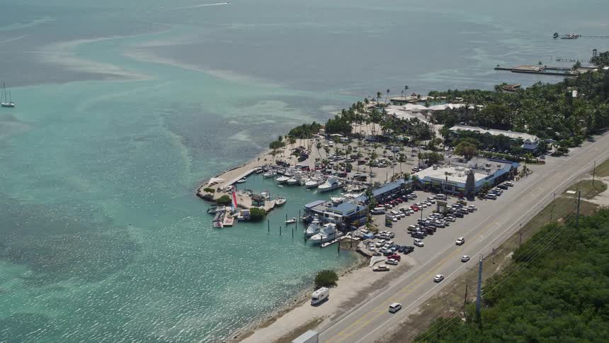 A stunning aerial view of the Whale Harbor Restaurant and Marina at Chesapeake Beach Resort in Islamorada Florida surrounded by beaches resorts and the beautiful coastline of the Florida Keys
