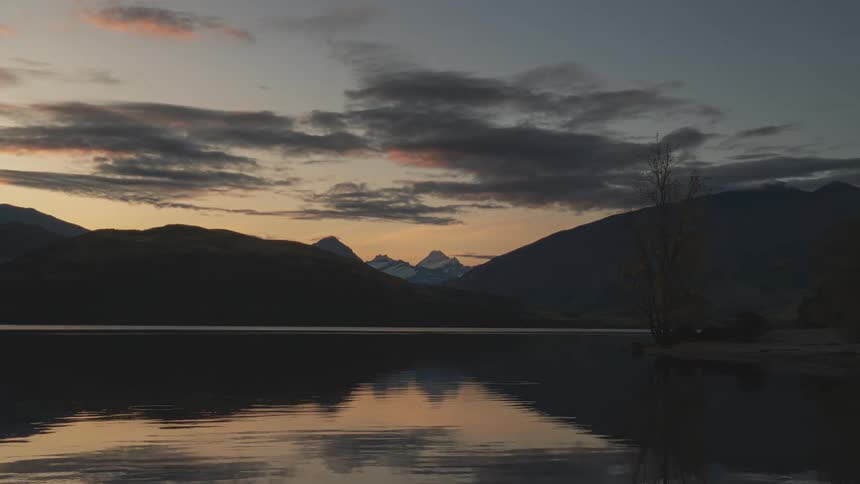 The sun is rising behind the mountains
