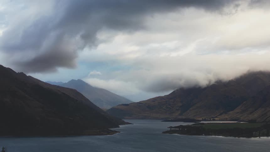 The clouds spin around above the mountains
