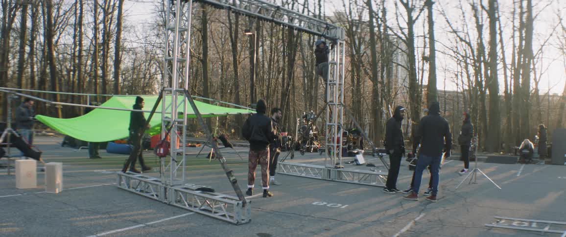 People assembling a tent and scaffolding