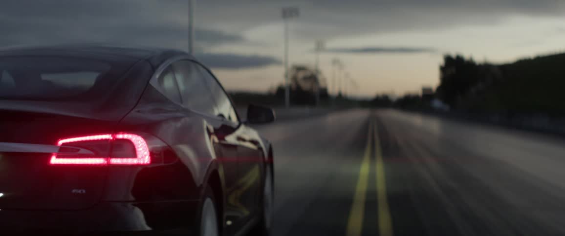A car drives down a racing track