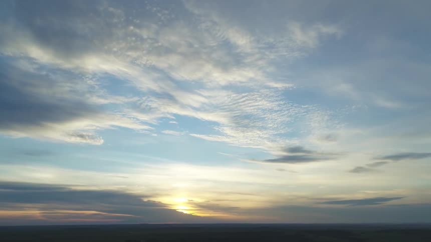 The sun rises over a massive agricultural land