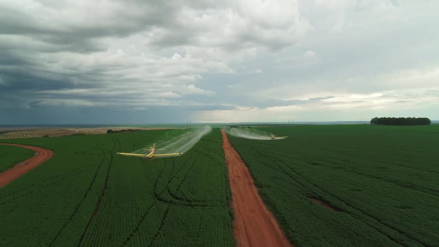 Two planes fly low over the landscape