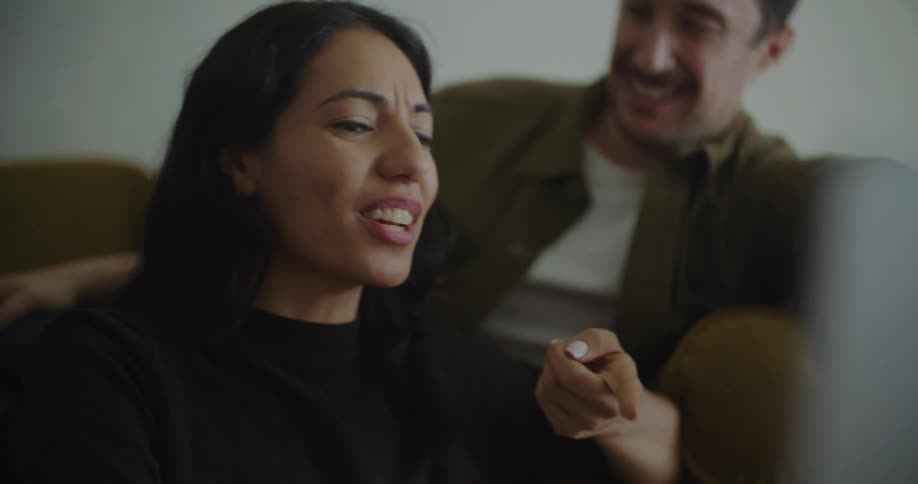 The view is of a young couple and they are laughing with each other
