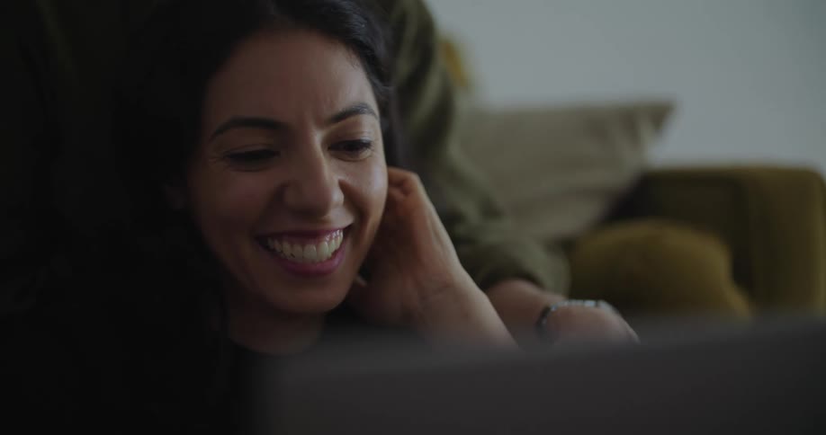 Young couple are being affectionate towards each other inside of their home