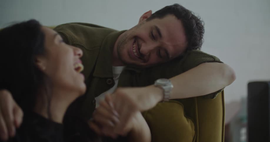 The view is of a happy couple that are hanging out at there house