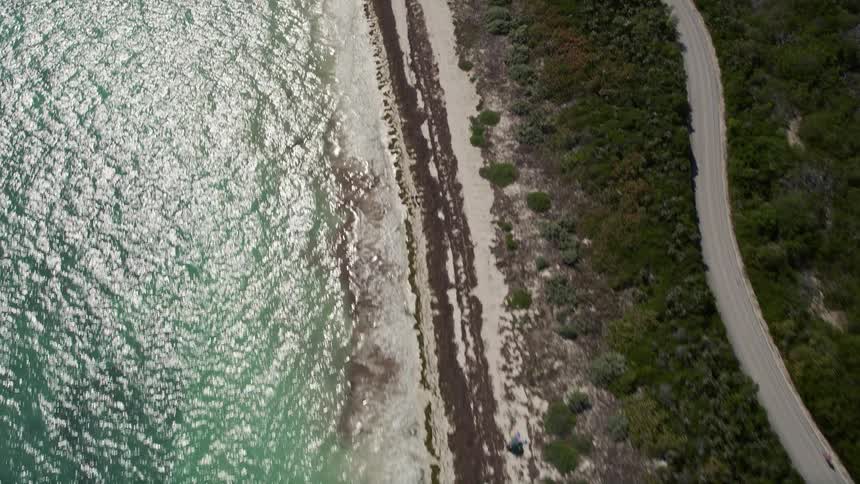 A birds eye view of people enjoying the beach on Bahai Honda Key Florida during summertime
