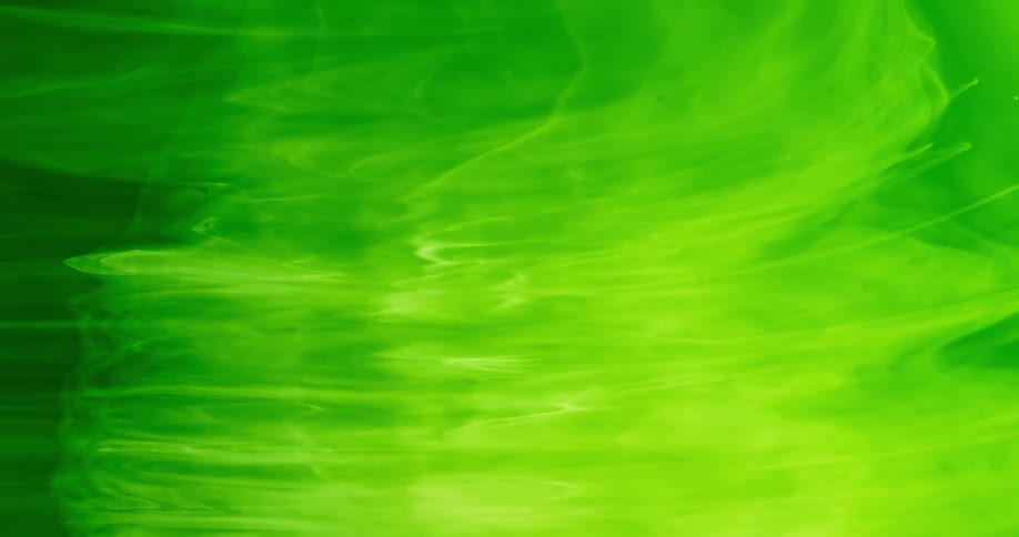 A wave of green liquid flows a short distance in this abstract scene
