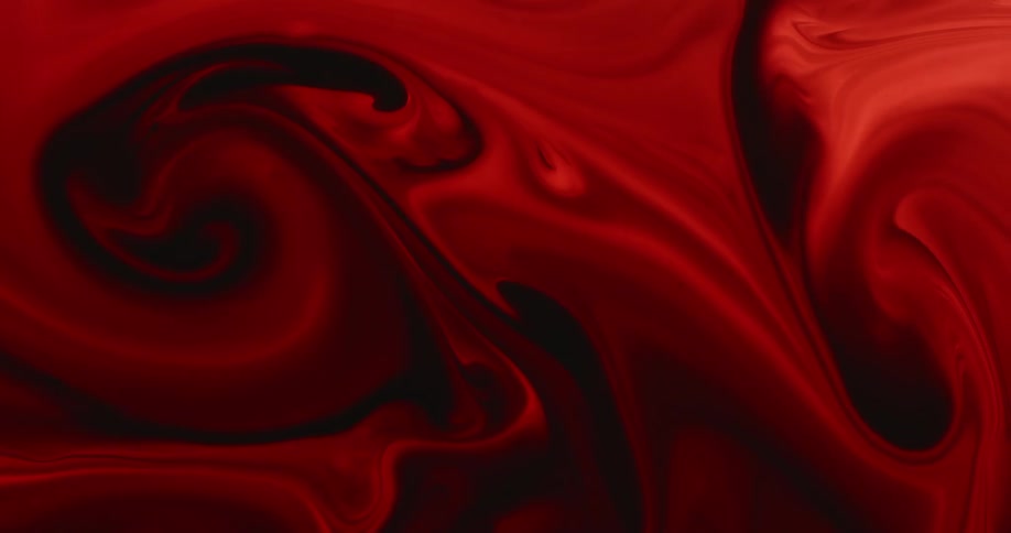 Red liquid is being mixed in the pattern