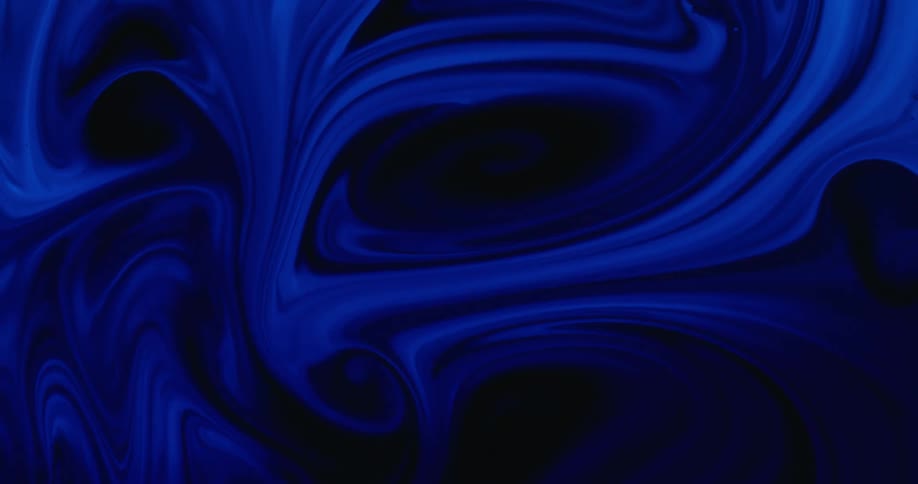 Layers of blue and black swirl in mixture